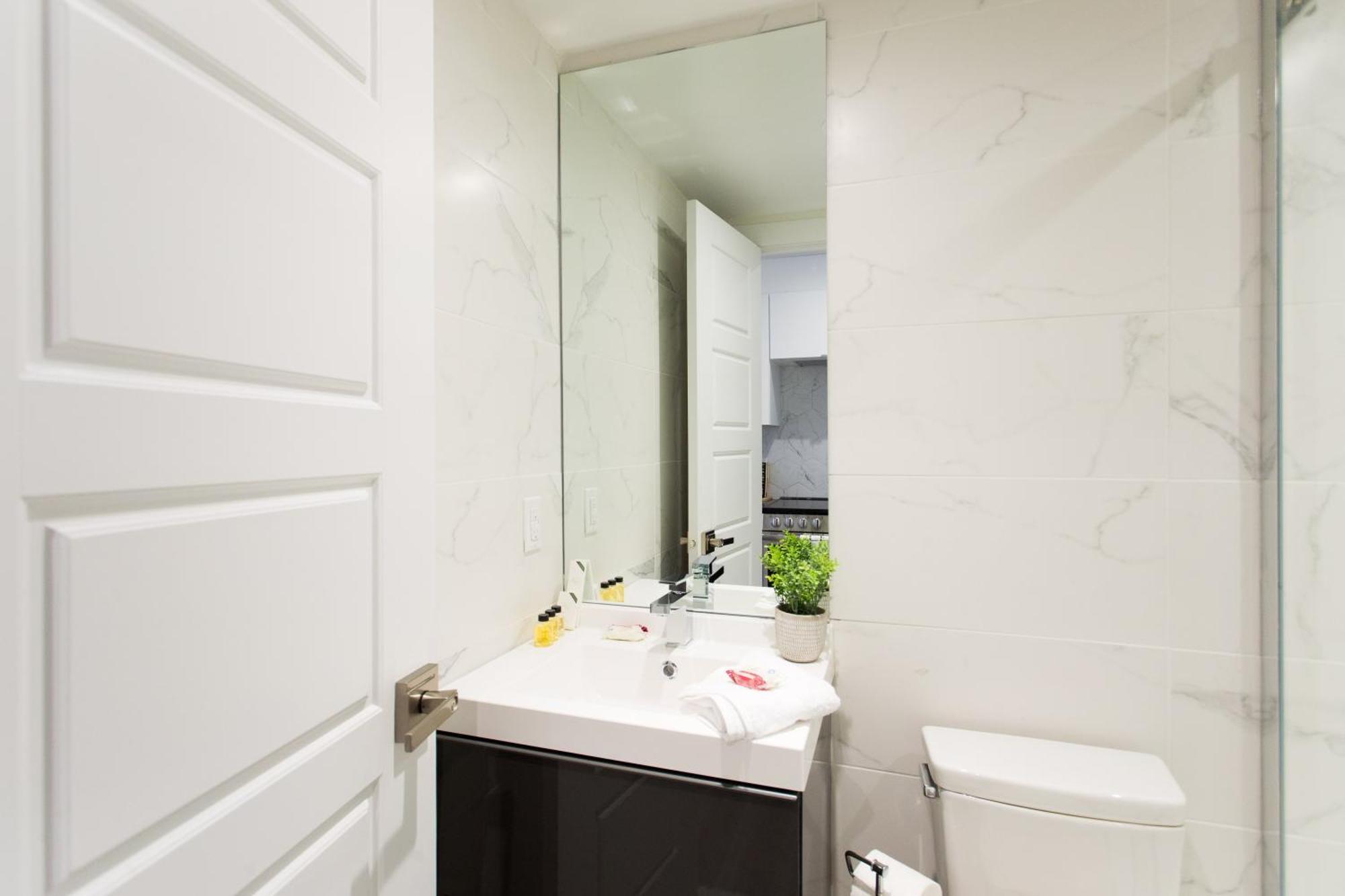 Serene And Styled Little Italy Full Bath By Den